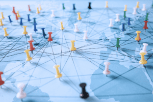 mp of the world with pins stuck in destinations