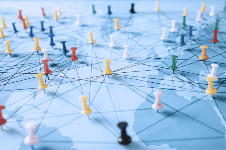 mp of the world with pins stuck in destinations